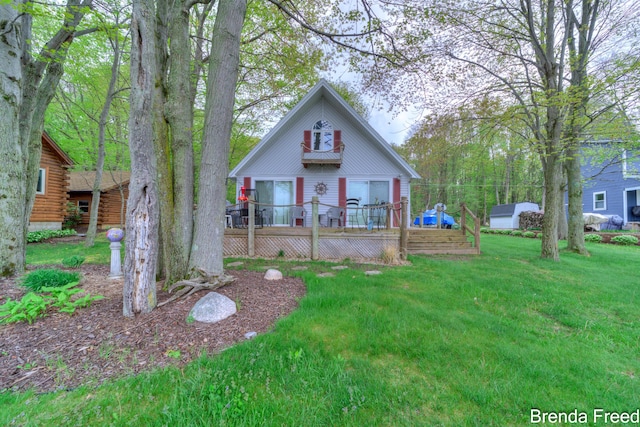 2551 Mayo Dr, Fremont, MI 49412 - view of front of property with a deck, a front lawn, and log exterior