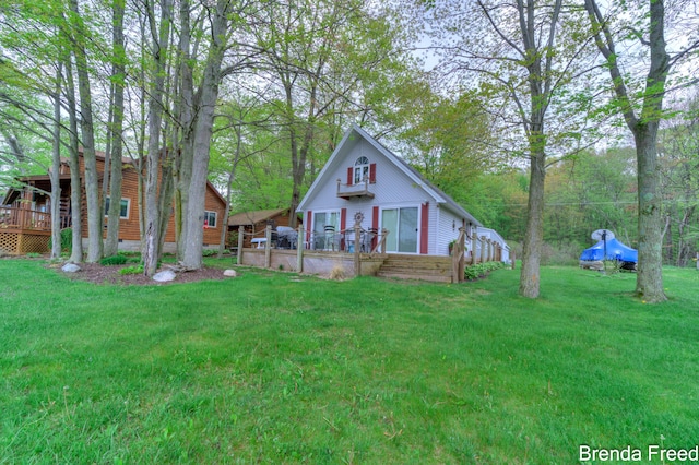 2551 Mayo Dr, Fremont, MI 49412 - view of front of home featuring a deck and a front yard