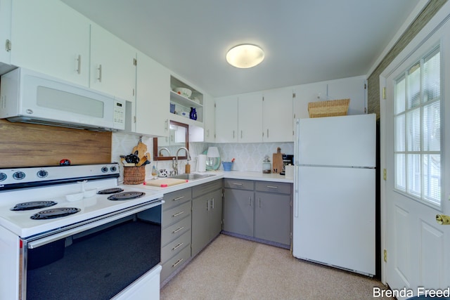 2551 Mayo Dr, Fremont, MI 49412 - kitchen with white appliances, a sink, gray cabinetry, open shelves, and tasteful backsplash