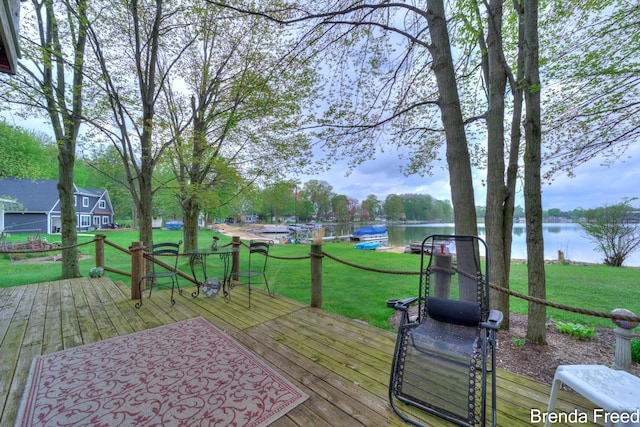 2551 Mayo Dr, Fremont, MI 49412 - deck with a water view and a lawn