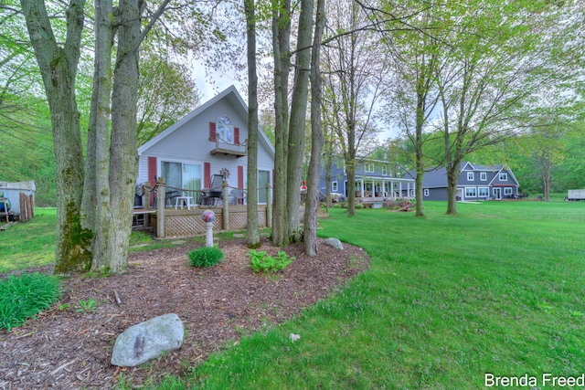 2551 Mayo Dr, Fremont, MI 49412 - view of front of home featuring a front lawn and a deck
