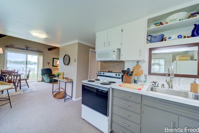 2551 Mayo Dr, Fremont, MI 49412 - kitchen featuring white appliances, a sink, gray cabinetry, light carpet, and tasteful backsplash