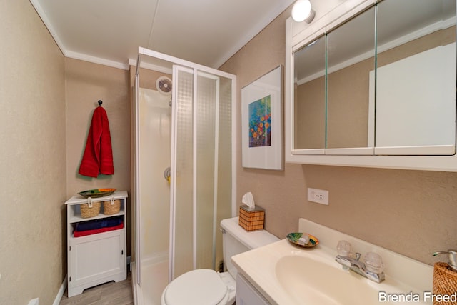 2551 Mayo Dr, Fremont, MI 49412 - bathroom with a shower stall, vanity, toilet, and ornamental molding