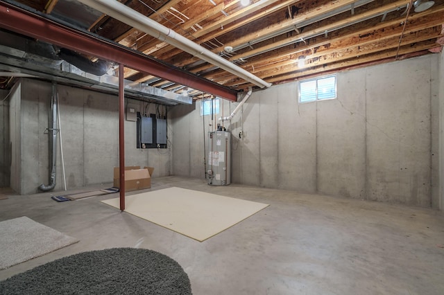 below grade area featuring water heater and electric panel