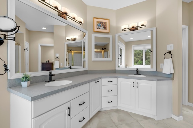 full bathroom featuring double vanity, tile patterned flooring, and an enclosed shower