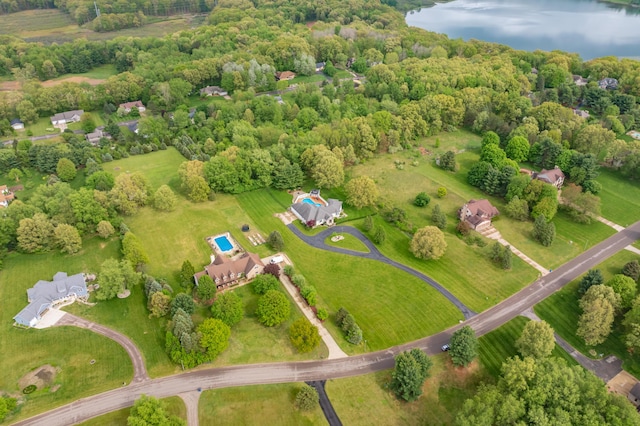 bird's eye view of a large body of water and a heavily wooded area
