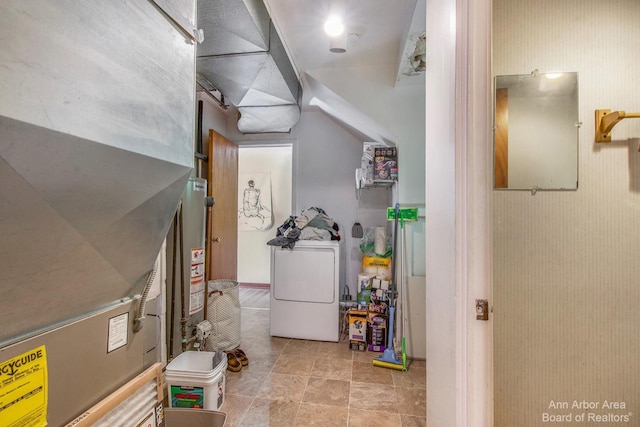below grade area with washer / clothes dryer and water heater