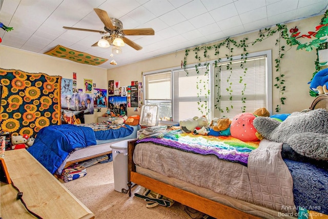 bedroom featuring ceiling fan and carpet flooring