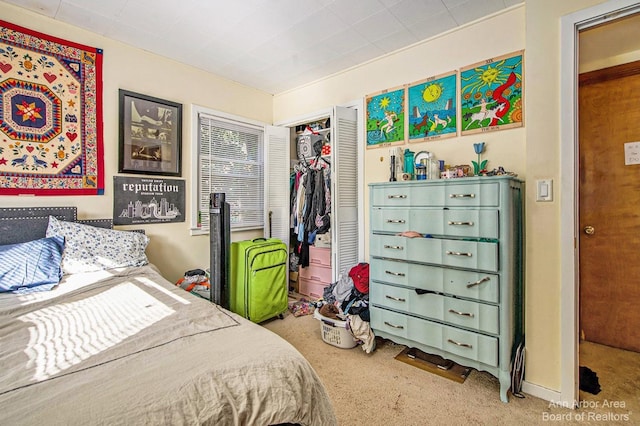carpeted bedroom featuring a closet
