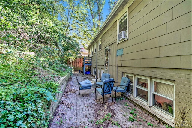 view of home's exterior featuring fence, a patio area, and cooling unit
