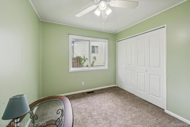 5170 Warmbriar Dr, White Lake, MI 48383 - unfurnished bedroom featuring carpet, ornamental molding, baseboards, a closet, and ceiling fan