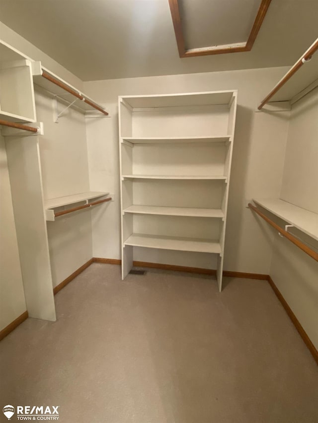 walk in closet with attic access