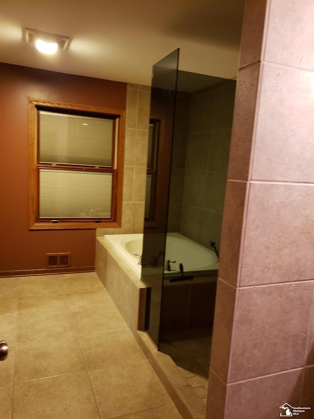 5015 Piehl Rd, Ottawa Lake, MI 49267 - full bathroom with a garden tub and tile patterned floors