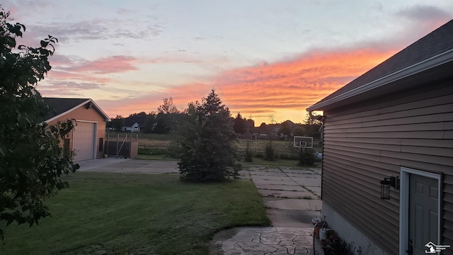 5015 Piehl Rd, Ottawa Lake, MI 49267 - yard at dusk with an outdoor structure and a patio