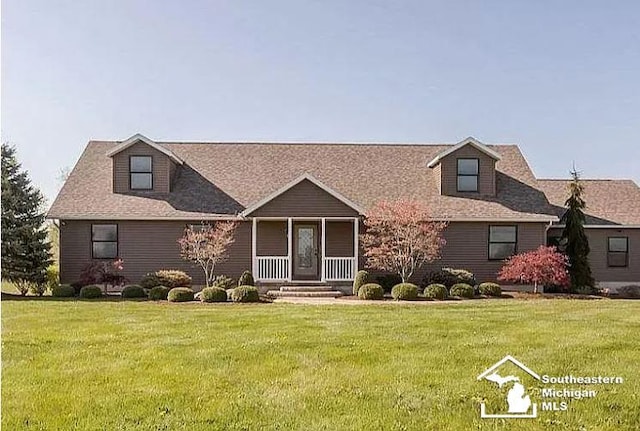 5015 Piehl Rd, Ottawa Lake, MI 49267 - view of front of house with a front yard and a porch