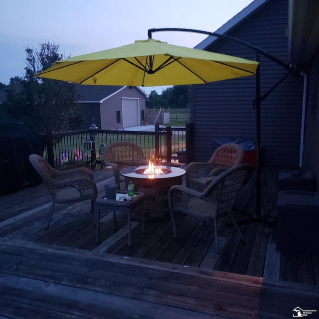 5015 Piehl Rd, Ottawa Lake, MI 49267 - wooden deck featuring a fire pit and an outbuilding