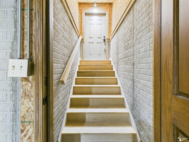 5015 Piehl Rd, Ottawa Lake, MI 49267 - stairway with brick wall