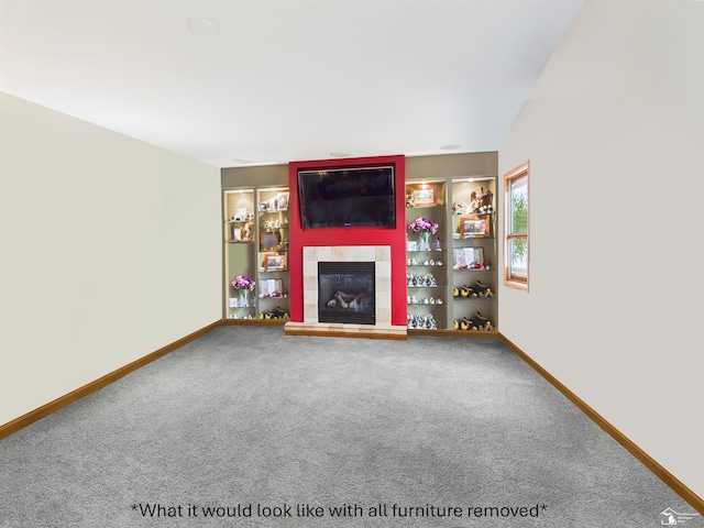 5015 Piehl Rd, Ottawa Lake, MI 49267 - unfurnished living room featuring a fireplace, carpet floors, and baseboards
