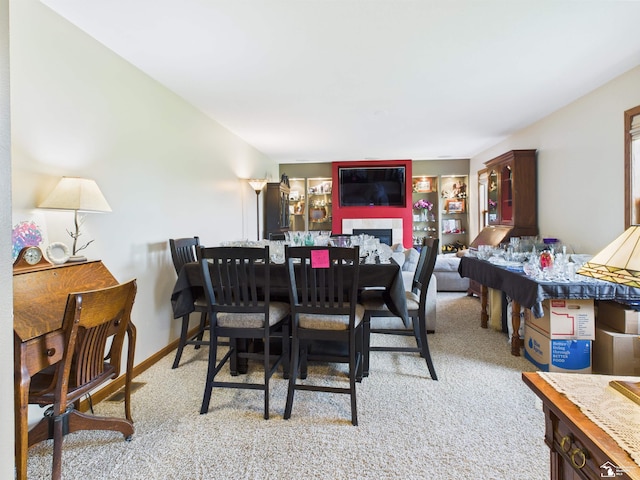 5015 Piehl Rd, Ottawa Lake, MI 49267 - dining area with light colored carpet and a fireplace