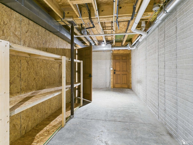 5015 Piehl Rd, Ottawa Lake, MI 49267 - unfinished basement featuring brick wall