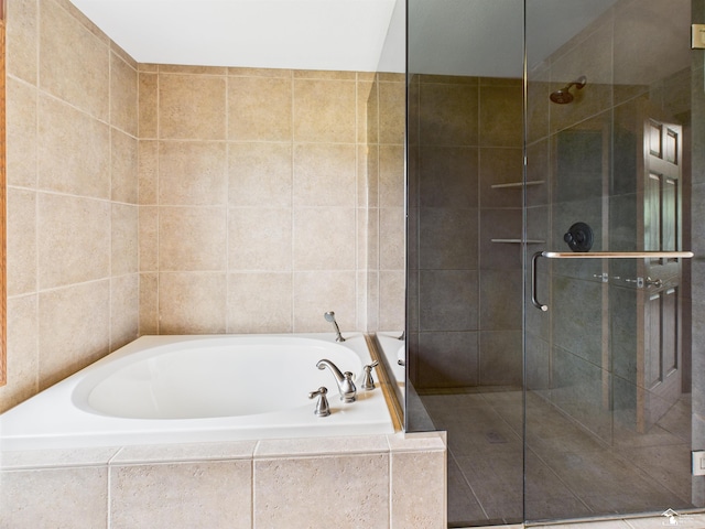 5015 Piehl Rd, Ottawa Lake, MI 49267 - full bath featuring a bath, a stall shower, and tile walls