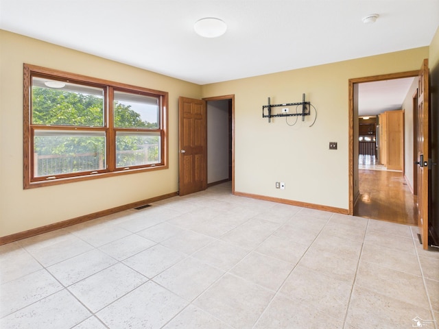 5015 Piehl Rd, Ottawa Lake, MI 49267 - spare room with light tile patterned floors and baseboards