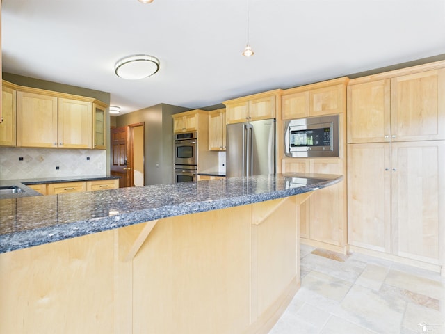 5015 Piehl Rd, Ottawa Lake, MI 49267 - kitchen with stainless steel appliances, light brown cabinetry, backsplash, and a peninsula