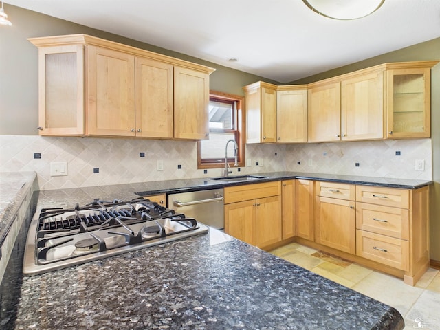 5015 Piehl Rd, Ottawa Lake, MI 49267 - kitchen with stainless steel appliances, light brown cabinetry, and dark stone counters