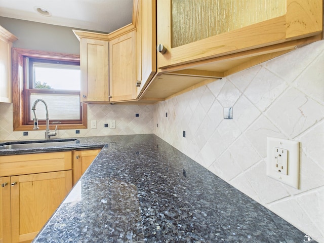 5015 Piehl Rd, Ottawa Lake, MI 49267 - kitchen with backsplash, dark stone countertops, and light brown cabinetry