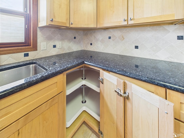 5015 Piehl Rd, Ottawa Lake, MI 49267 - kitchen featuring tasteful backsplash, dark stone countertops, and light brown cabinets