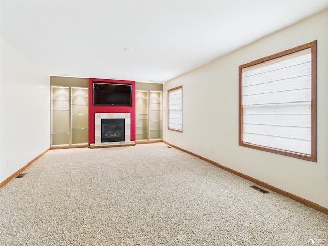 5015 Piehl Rd, Ottawa Lake, MI 49267 - unfurnished living room with carpet floors and a tiled fireplace