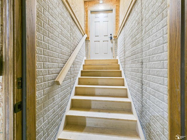 5015 Piehl Rd, Ottawa Lake, MI 49267 - stairway with brick wall
