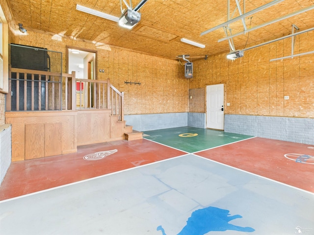5015 Piehl Rd, Ottawa Lake, MI 49267 - garage with a garage door opener and wainscoting