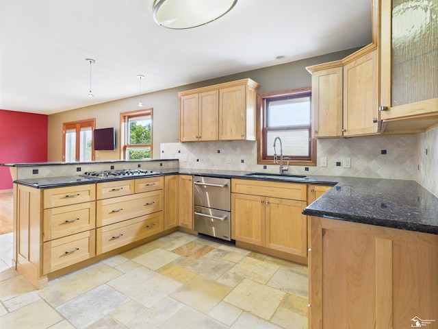 5015 Piehl Rd, Ottawa Lake, MI 49267 - kitchen with a peninsula, backsplash, stainless steel appliances, light brown cabinets, and dark stone countertops