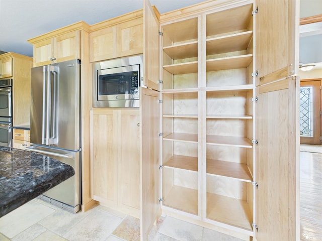 5015 Piehl Rd, Ottawa Lake, MI 49267 - kitchen featuring appliances with stainless steel finishes, light brown cabinetry, dark stone countertops, and open shelves