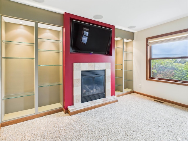 5015 Piehl Rd, Ottawa Lake, MI 49267 - unfurnished living room with a tile fireplace and carpet floors