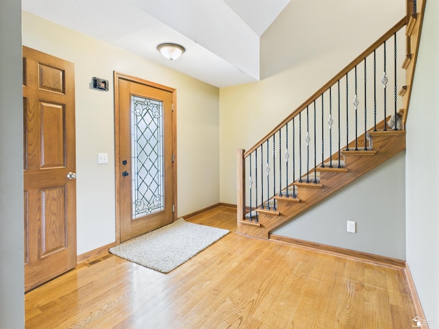 5015 Piehl Rd, Ottawa Lake, MI 49267 - entrance foyer with wood finished floors and stairway