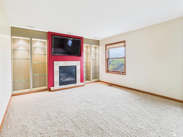 5015 Piehl Rd, Ottawa Lake, MI 49267 - unfurnished living room with carpet and a tiled fireplace