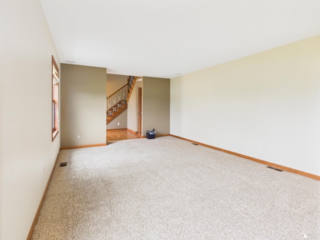 5015 Piehl Rd, Ottawa Lake, MI 49267 - carpeted spare room with stairs and baseboards