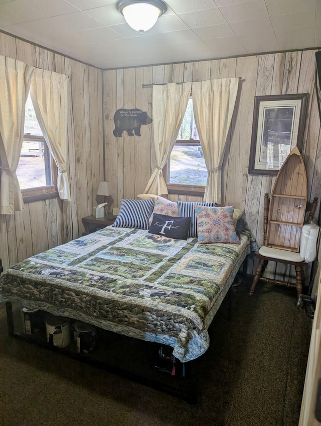 9600 S Oxeye, Baldwin, MI 49304 - bedroom with wooden walls and carpet flooring