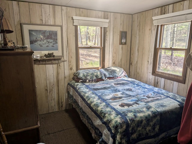 9600 S Oxeye, Baldwin, MI 49304 - bedroom featuring wooden walls and carpet flooring