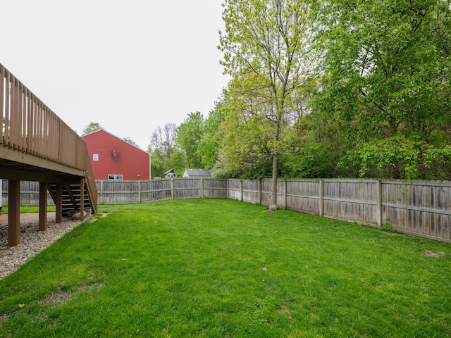 view of yard featuring stairway and a wooden deck