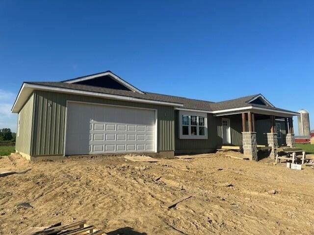 9745 W Michigan Ave, Grass Lake, MI 49240 - view of front of house with a garage and covered porch