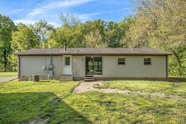 115 E X Y Ave, Vicksburg, MI 49097 - back of house with central AC, a lawn, and entry steps