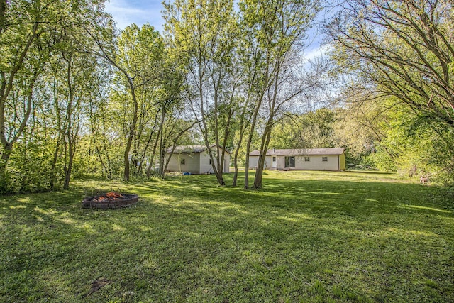 115 E X Y Ave, Vicksburg, MI 49097 - view of green lawn with a fire pit