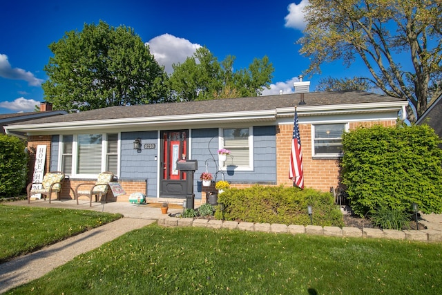 8210 N Henry Ruff Rd, Westland, MI 48185 - view of front of home featuring brick siding and a front lawn