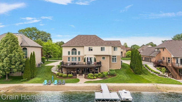 49729 Sandra Dr, Shelby Twp, MI 48315 - back of house featuring a lawn, a deck with water view, stairway, a patio, and a residential view