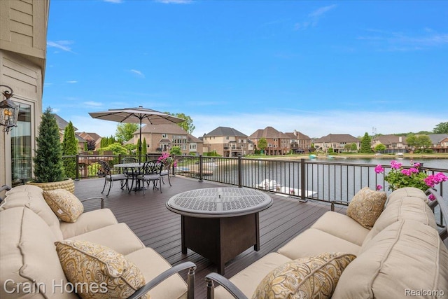 49729 Sandra Dr, Shelby Twp, MI 48315 - wooden terrace with an outdoor hangout area, a residential view, outdoor dining area, and a water view