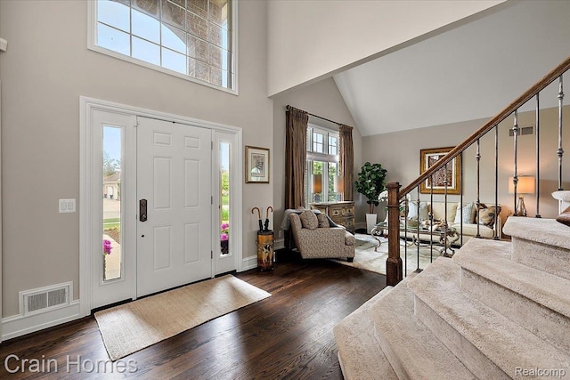 49729 Sandra Dr, Shelby Twp, MI 48315 - foyer entrance with a high ceiling, stairway, wood finished floors, and baseboards