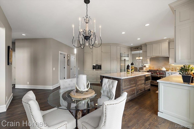49729 Sandra Dr, Shelby Twp, MI 48315 - dining area with dark wood-type flooring, a chandelier, baseboards, and recessed lighting
